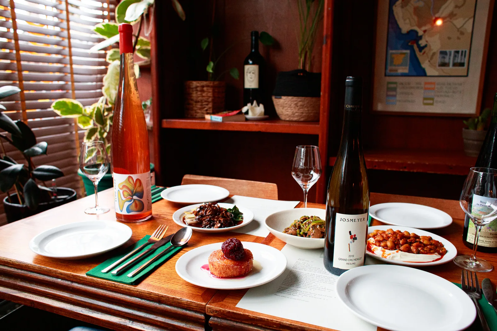 Wine and vegetarian dishes on a table at Sylvan