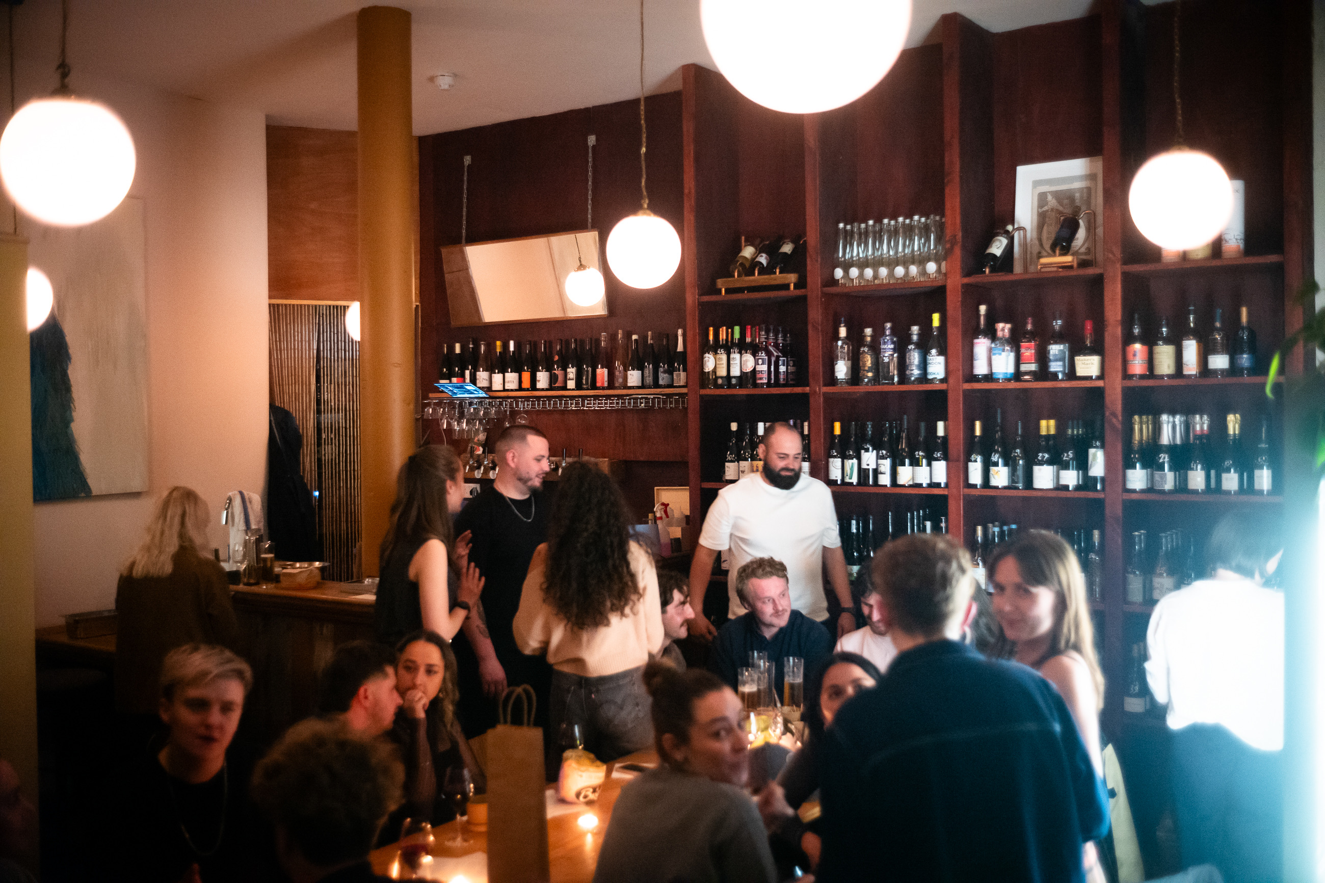 Guests enjoying a busy evening at La Cave